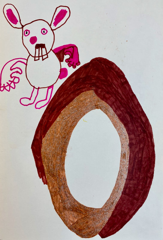 A drawing of an easter egg and the easter bunny drawn with felt pens
